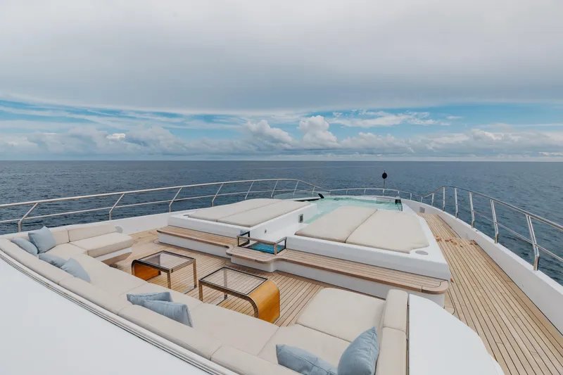 Goldeneye Yacht Photos Pics Luxurious deck of 2020 Mangusta 54 Gransport yacht with ocean view and elegant seating.