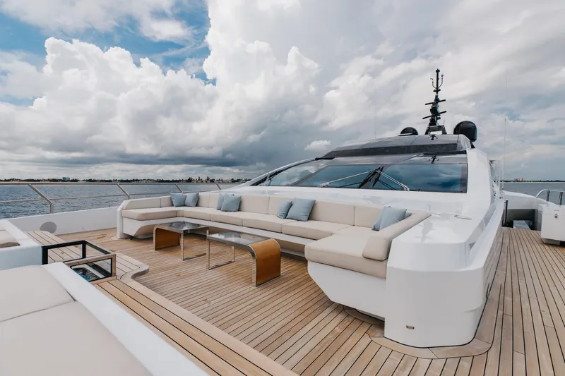 Goldeneye Yacht Photos Pics Luxurious 2020 Mangusta 54 Gransport yacht deck with elegant seating and ocean view.