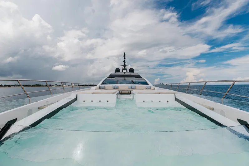 Goldeneye Yacht Photos Pics Luxurious 2020 Mangusta 54 Gransport yacht with a stunning deck pool and ocean view.