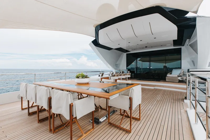 Goldeneye Yacht Photos Pics Luxury deck of 2020 Mangusta 54 Gransport yacht with elegant dining area.