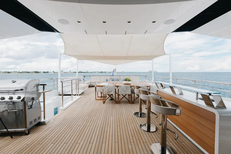 Goldeneye Yacht Photos Pics Luxurious deck of 2020 Mangusta 54 Gransport yacht with seating and ocean view.