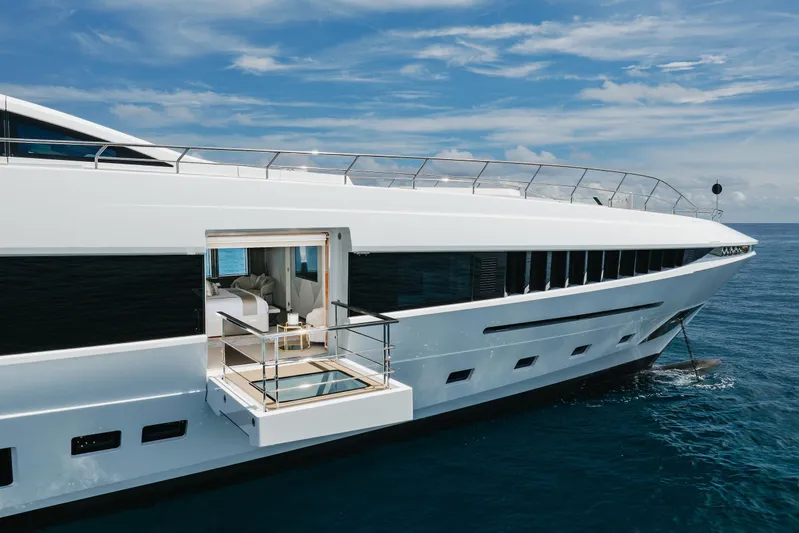 Goldeneye Yacht Photos Pics Luxury 2020 Mangusta 54 Gransport yacht with open deck, cruising on a sunny day.