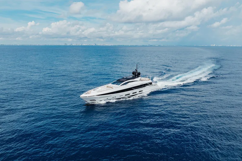 Goldeneye Yacht Photos Pics 2020 Mangusta 54 Gransport yacht cruising on open ocean under blue sky.