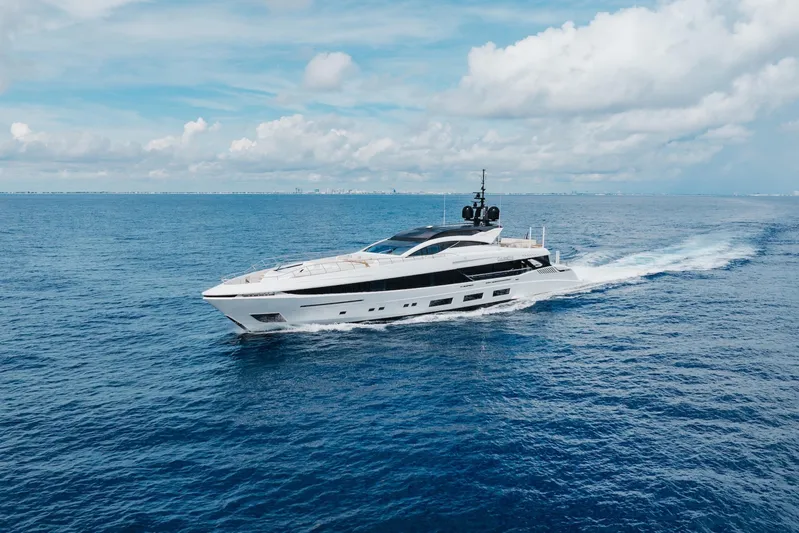 Goldeneye Yacht Photos Pics 2020 Mangusta 54 Gransport yacht cruising on open sea under blue sky.