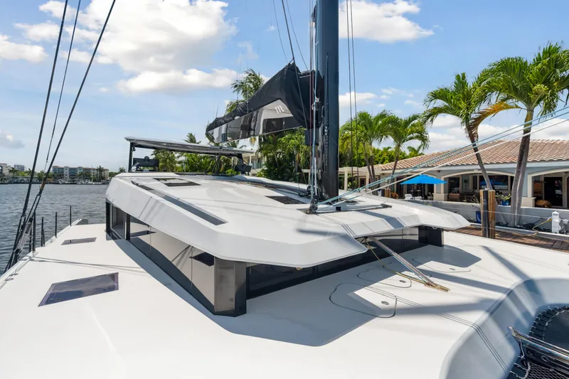 Noble House Yacht Photos Pics 2019 McConaghy MC60 yacht docked, showcasing sleek design and modern architecture.