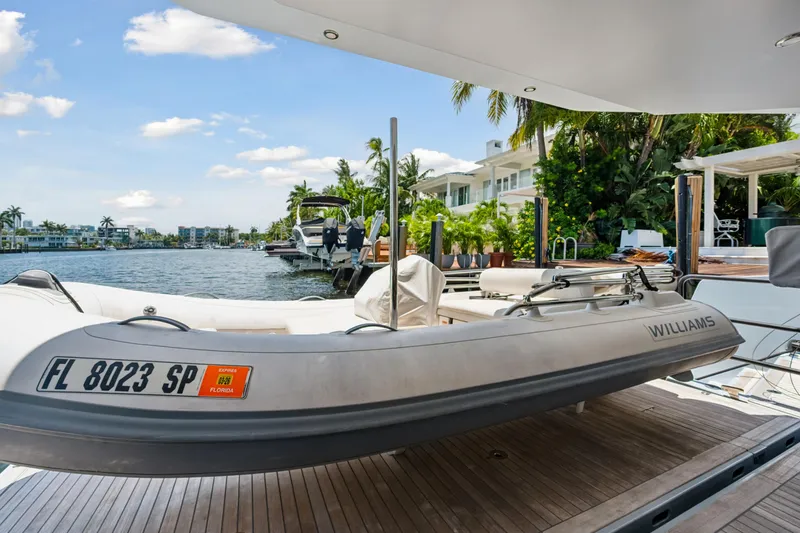 Noble House Yacht Photos Pics 2019 McConaghy MC60 yacht with Williams tender docked by waterfront homes.