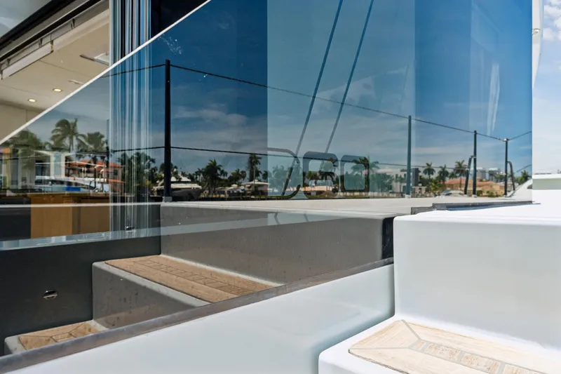 Noble House Yacht Photos Pics 2019 McConaghy MC60 yacht deck with sleek glass reflections and modern design elements.