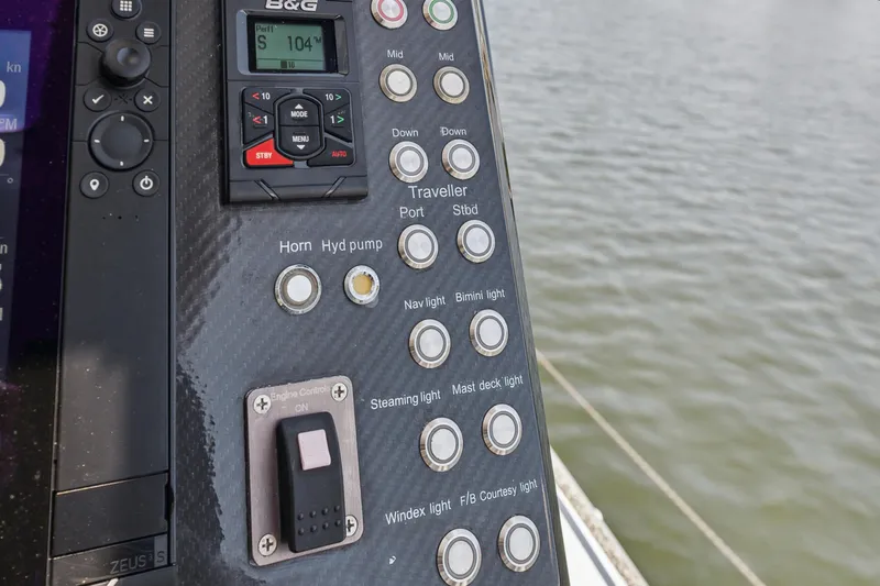 Noble House Yacht Photos Pics Control panel of a 2019 McConaghy MC60 yacht with various navigation buttons.