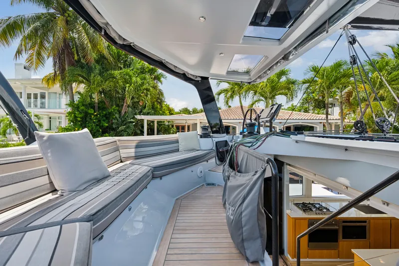 Noble House Yacht Photos Pics Luxurious 2019 McConaghy MC60 yacht interior with sleek seating and modern design.