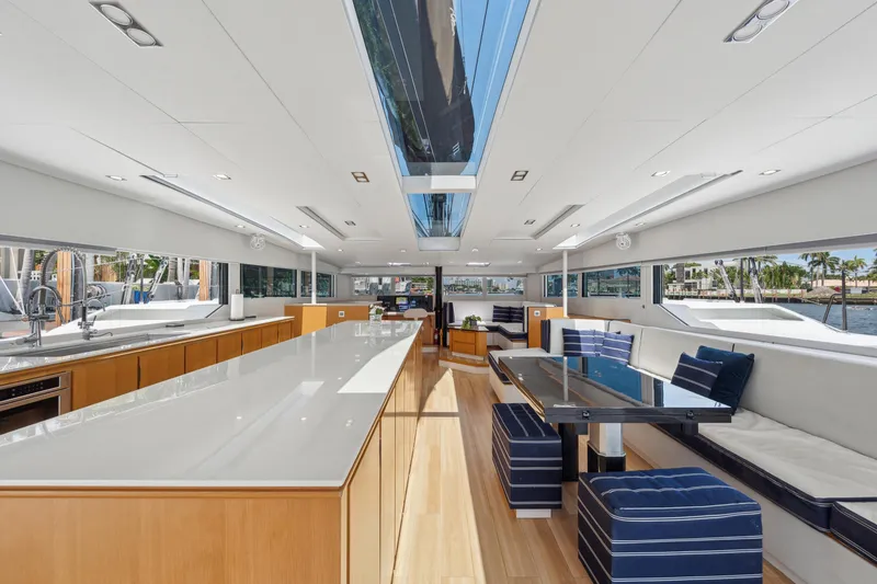 Noble House Yacht Photos Pics Luxurious interior of 2019 McConaghy MC60 yacht with sleek design and modern furnishings.