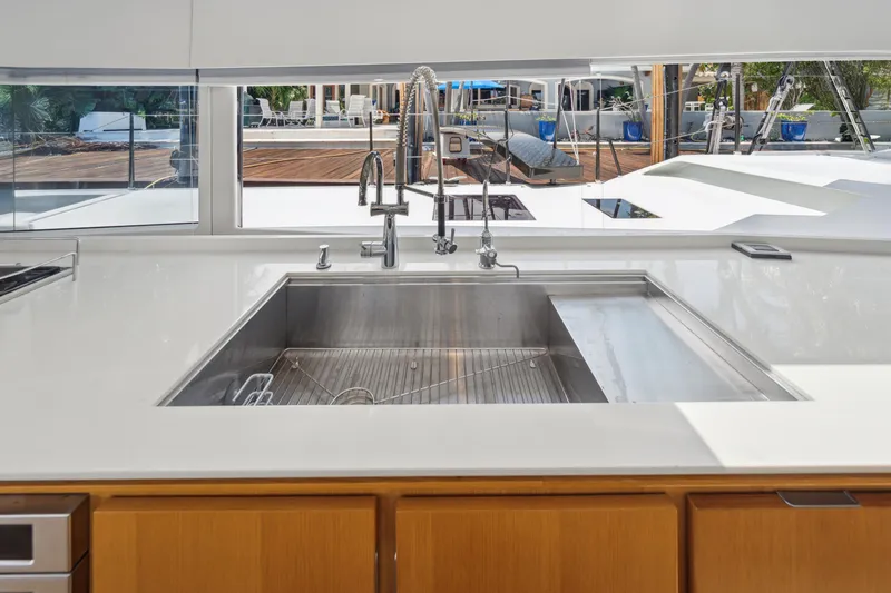 Noble House Yacht Photos Pics Modern kitchen sink on McConaghy MC60 yacht, 2019 model, with outdoor view.