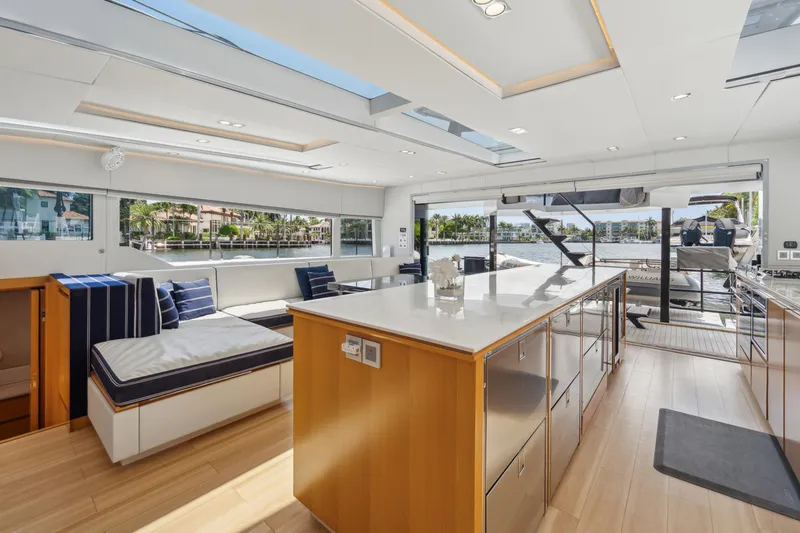 Noble House Yacht Photos Pics Luxurious interior of 2019 McConaghy MC60 yacht with modern design and waterfront view.