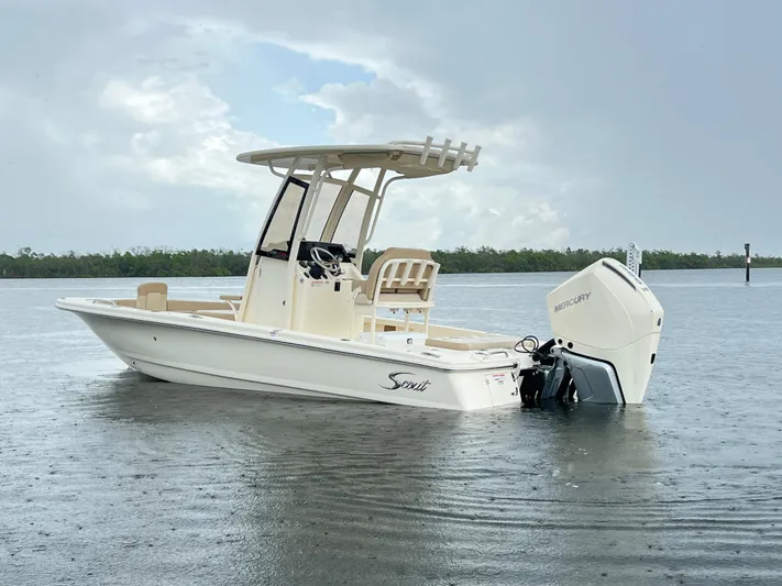  Yacht Photos Pics 2025 Scout 231 XSB boat on water, featuring Mercury outboard motor.