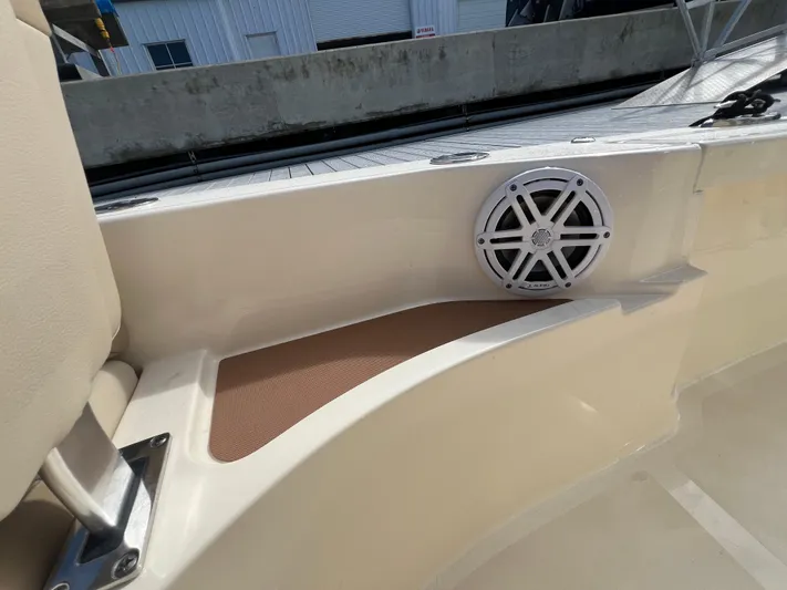  Yacht Photos Pics 2025 Scout 231 XSB boat interior with speaker and seating detail.