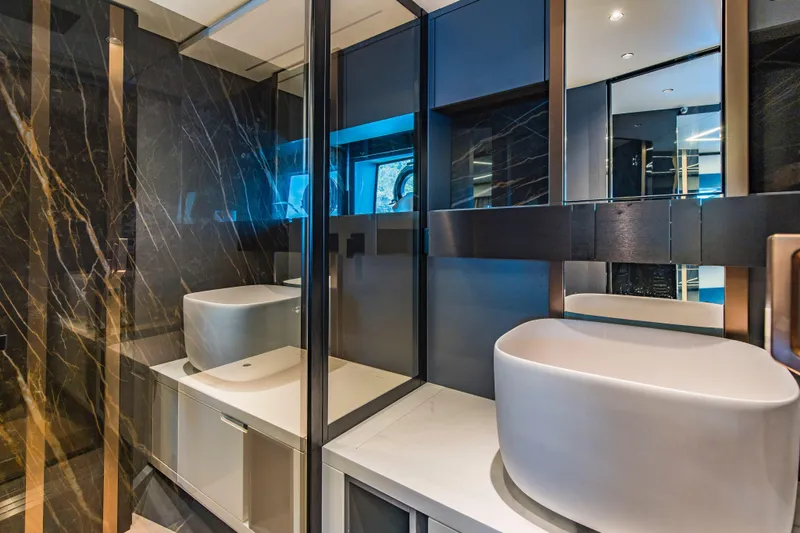  Yacht Photos Pics Luxurious modern bathroom with sleek design in 2025 Explorer 62 model yacht.