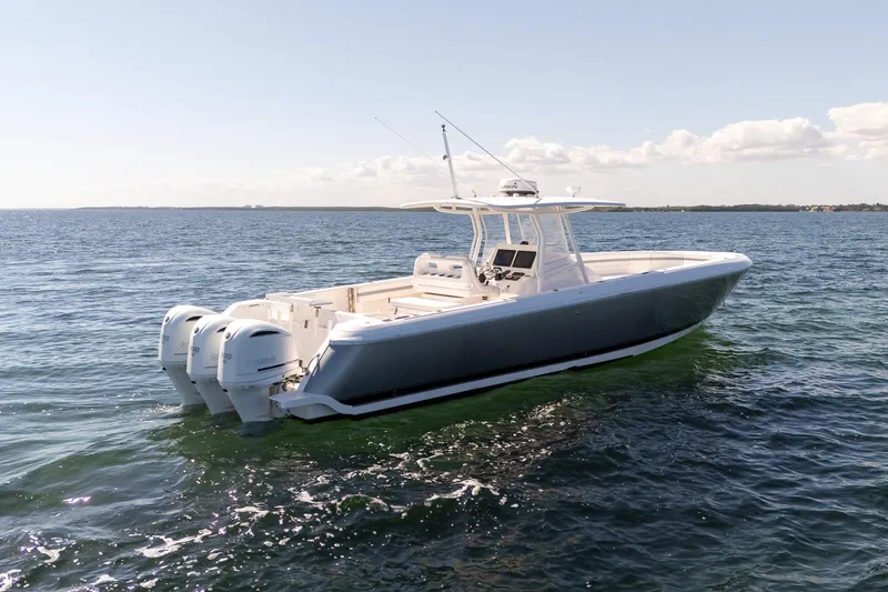  Yacht Photos Pics 2015 Intrepid 400 Center Console boat on open water, featuring triple outboard engines.