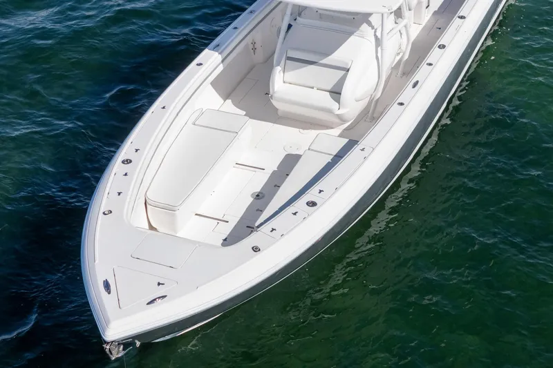  Yacht Photos Pics 2015 Intrepid 400 Center Console boat on clear water, showcasing sleek design and spacious deck.