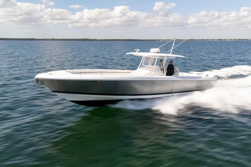  Yacht Photos Pics 2015 Intrepid 400 Center Console boat cruising on open water under a cloudy sky.