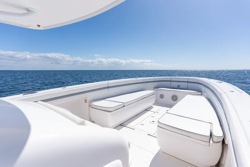  Yacht Photos Pics 2015 Intrepid 400 Center Console boat with spacious seating, ocean view, and clear blue sky.
