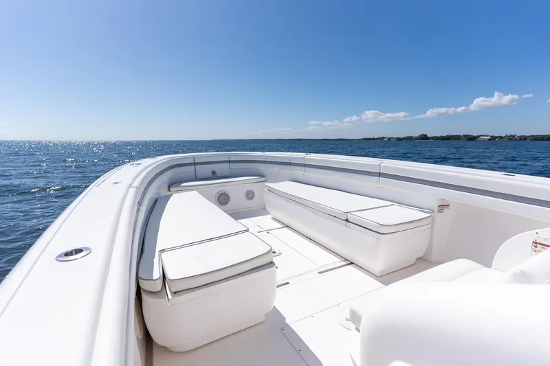  Yacht Photos Pics 2015 Intrepid 400 Center Console boat on open water, clear sky, spacious seating.