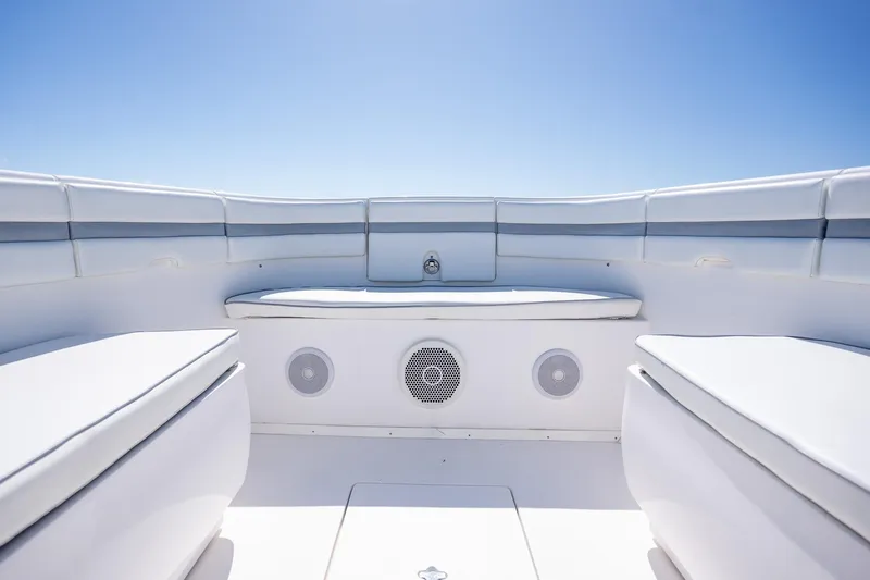  Yacht Photos Pics 2015 Intrepid 400 Center Console boat interior with cushioned seating and speakers under clear blue sky.