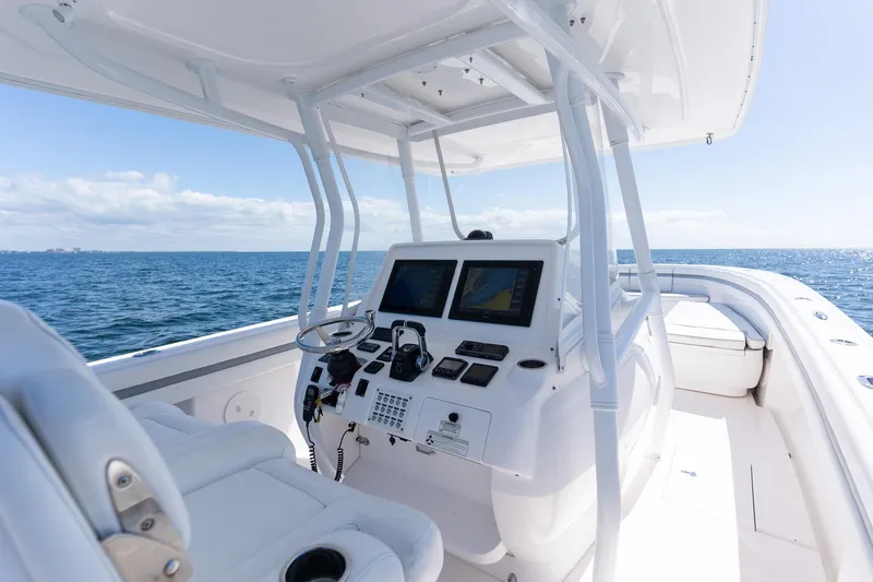  Yacht Photos Pics 2015 Intrepid 400 Center Console boat interior with navigation screens, steering wheel, and ocean view.