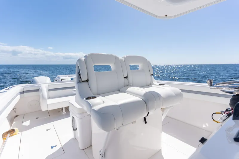  Yacht Photos Pics 2015 Intrepid 400 Center Console boat interior with ocean view, featuring white seating.