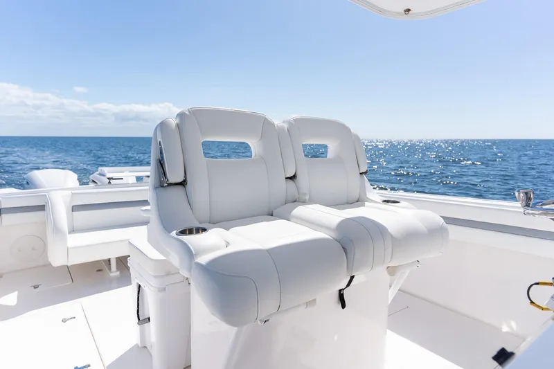  Yacht Photos Pics 2015 Intrepid 400 Center Console boat with white seating, ocean view.