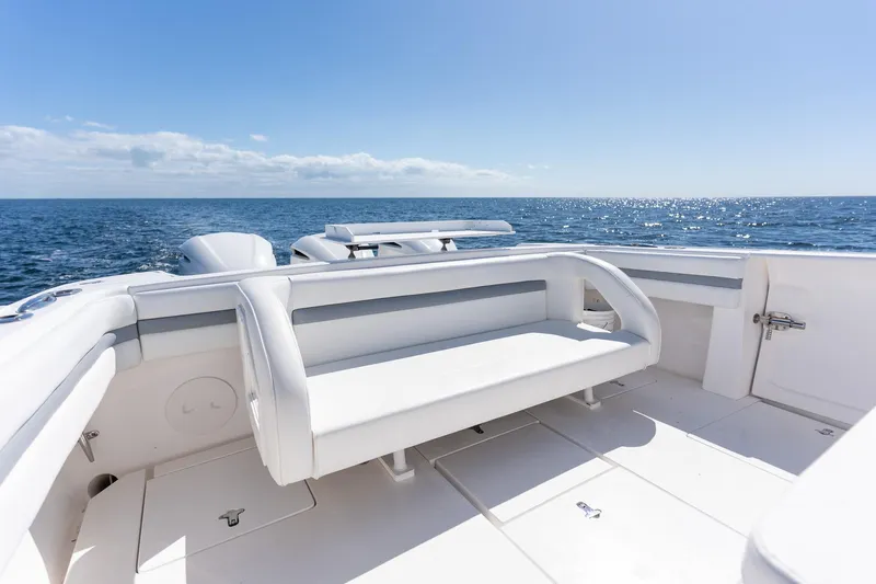  Yacht Photos Pics 2015 Intrepid 400 Center Console boat with white seating, ocean view, and clear blue sky.