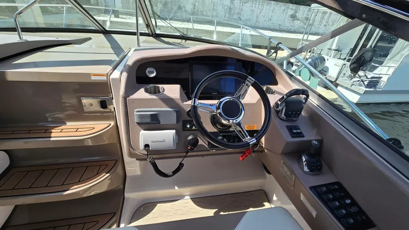  Yacht Photos Pics 2017 Regal 32 Express boat cockpit with steering wheel and control panel.