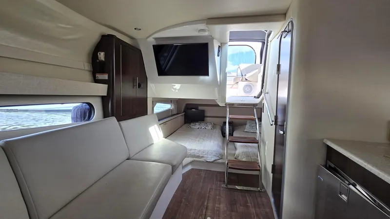  Yacht Photos Pics Interior of 2017 Regal 32 Express yacht with modern seating and sleeping area.