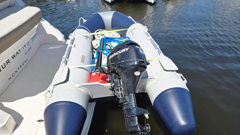  Yacht Photos Pics Inflatable boat with Mercury outboard motor docked beside 2017 Regal 32 Express.