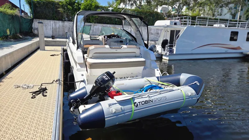  Yacht Photos Pics 2017 Regal 32 Express boat docked with inflatable Tobin Sports dinghy attached.