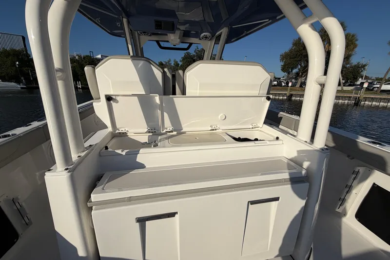  Yacht Photos Pics 2023 Pursuit S 328 Sport boat interior with open storage compartments.
