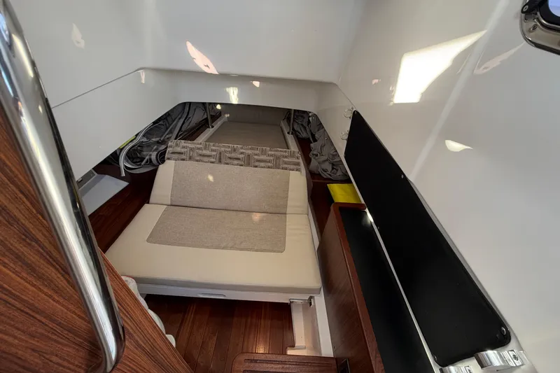  Yacht Photos Pics Interior cabin of 2023 Pursuit S 328 Sport boat with seating and storage.