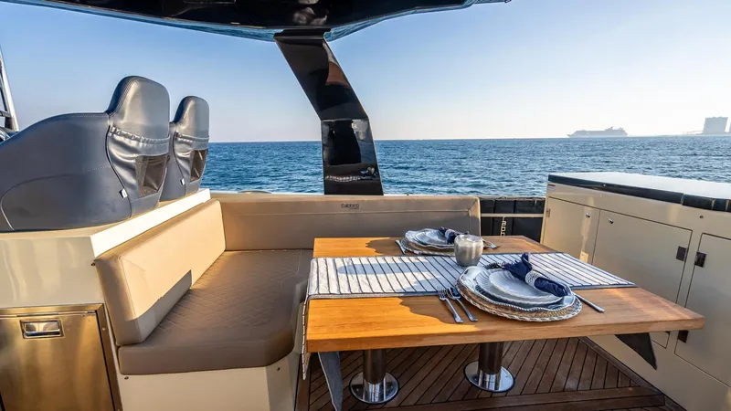  Yacht Photos Pics Luxury dining area on 2025 Fabbro F45 CABRIO yacht with ocean view.
