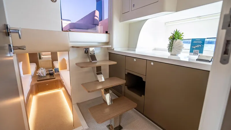  Yacht Photos Pics Luxurious interior of 2025 Fabbro F45 CABRIO yacht with modern kitchen and elegant staircase.