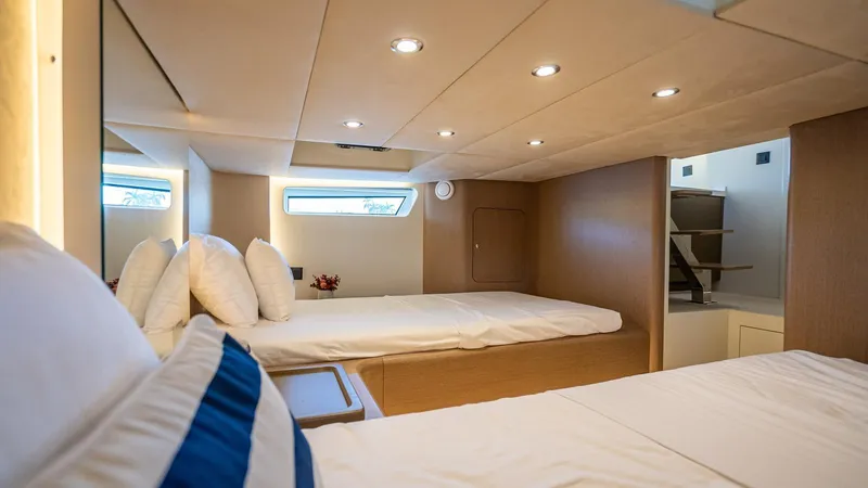  Yacht Photos Pics Luxurious cabin interior of 2025 Fabbro F45 CABRIO yacht with modern design and cozy bedding.