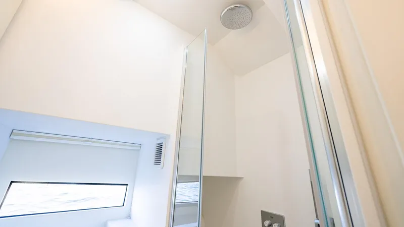  Yacht Photos Pics Modern bathroom interior in 2025 Fabbro F45 CABRIO yacht, featuring sleek design and skylight.