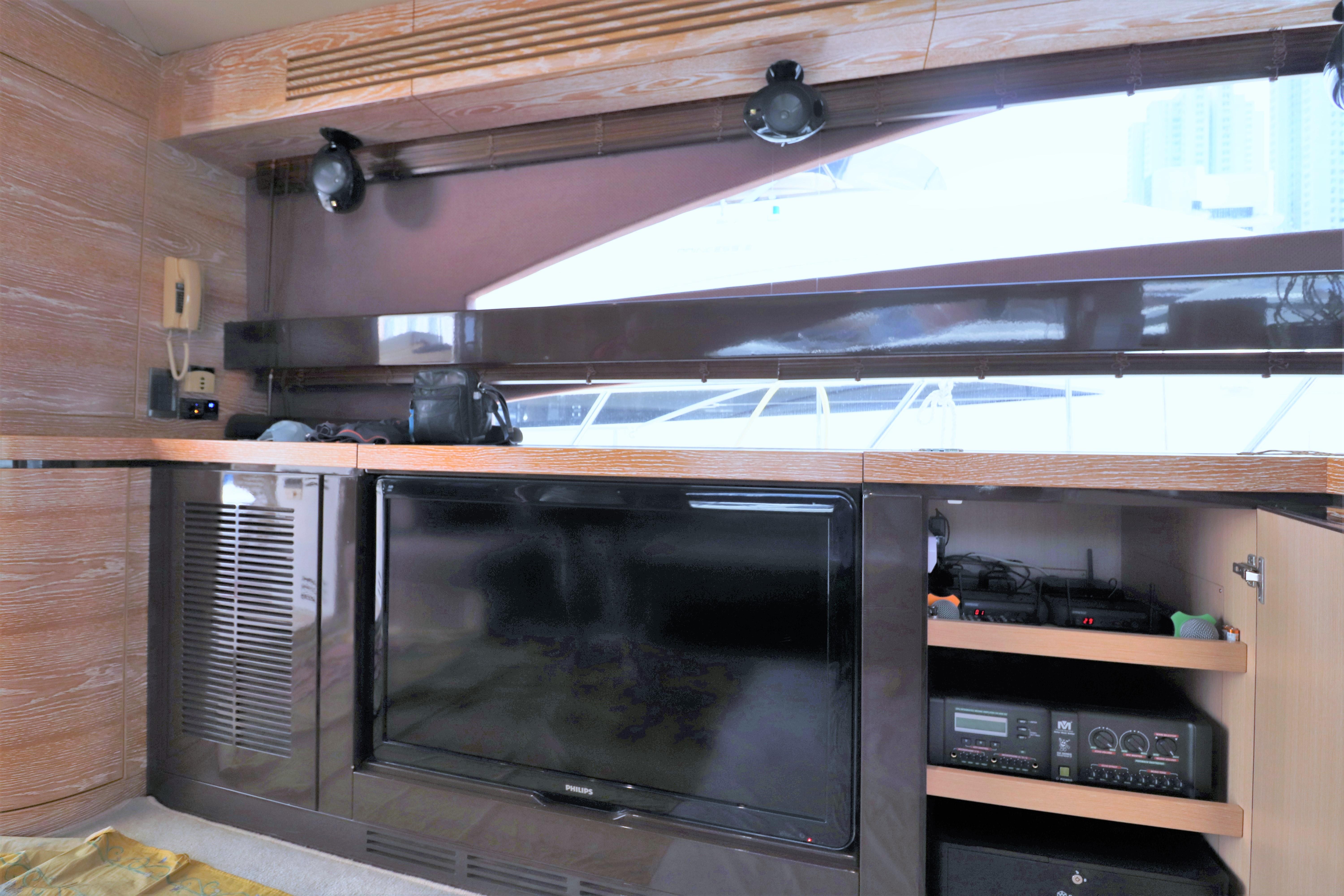 Luxurious interior of a 2010 Ruby 65 Feet Yacht with modern entertainment system.