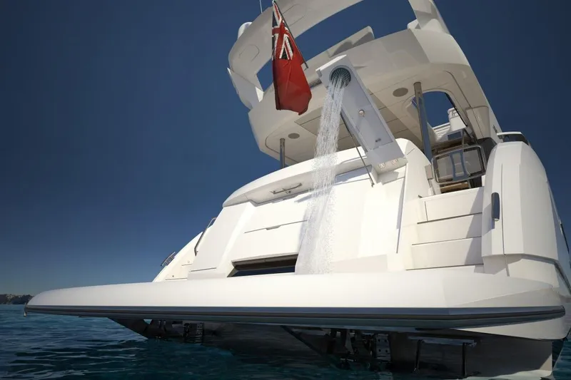  Yacht Photos Pics 2019 Sunseeker Manhattan 66 yacht with water feature and flag, viewed from the stern.