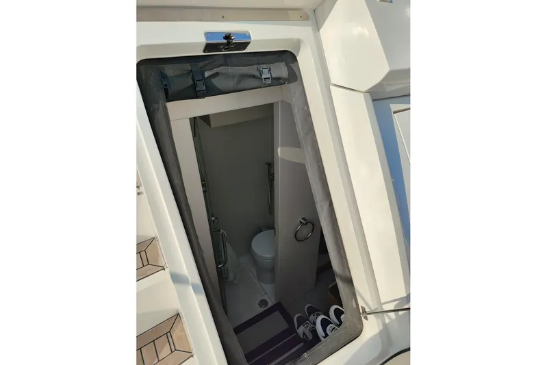  Yacht Photos Pics Interior view of 2019 Sunseeker Manhattan 66 yacht bathroom with modern fixtures.