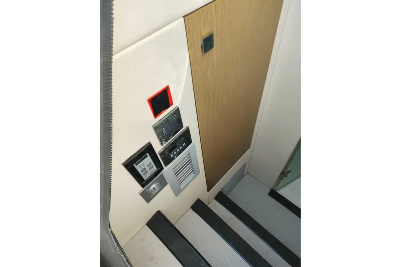  Yacht Photos Pics Control panel on 2019 Sunseeker Manhattan 66 yacht interior staircase.