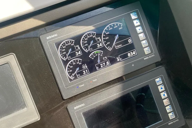  Yacht Photos Pics Digital control panel on a 2019 Sunseeker Manhattan 66 yacht dashboard.
