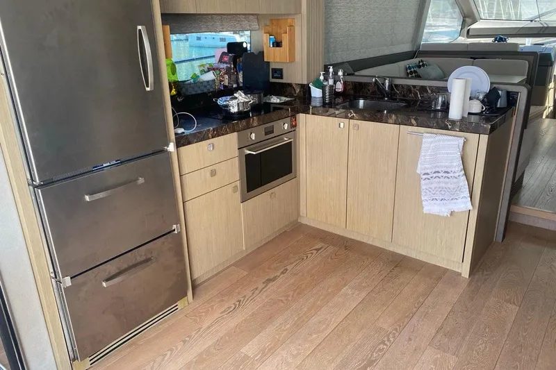  Yacht Photos Pics Luxurious kitchen interior of 2019 Sunseeker Manhattan 66 yacht with modern appliances.
