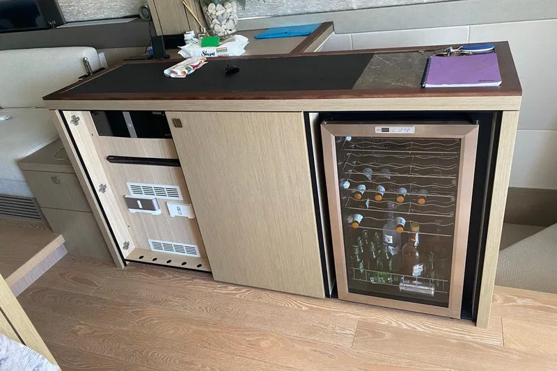  Yacht Photos Pics Luxury yacht interior with wine cooler, Sunseeker Manhattan 66, 2019 model.