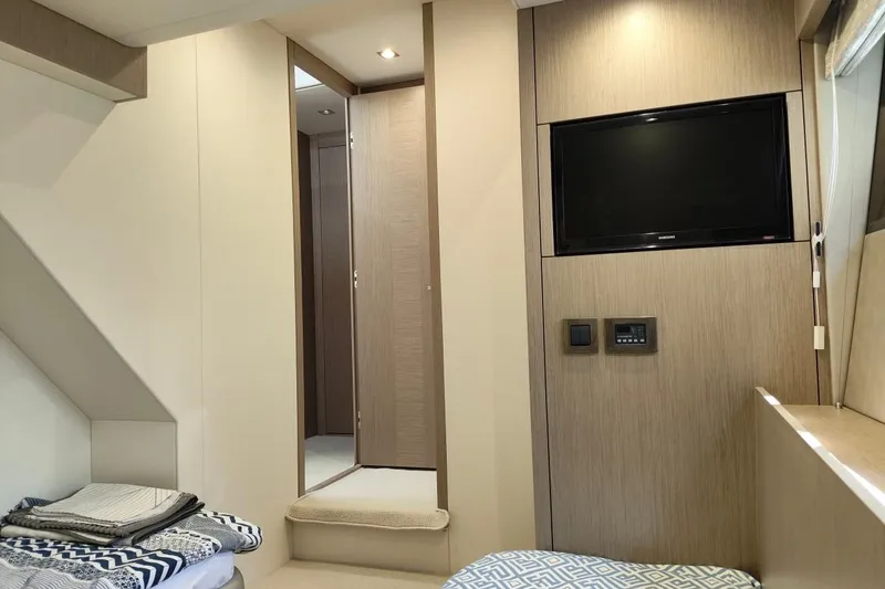  Yacht Photos Pics Luxurious interior of 2019 Sunseeker Manhattan 66 yacht with TV and modern decor.