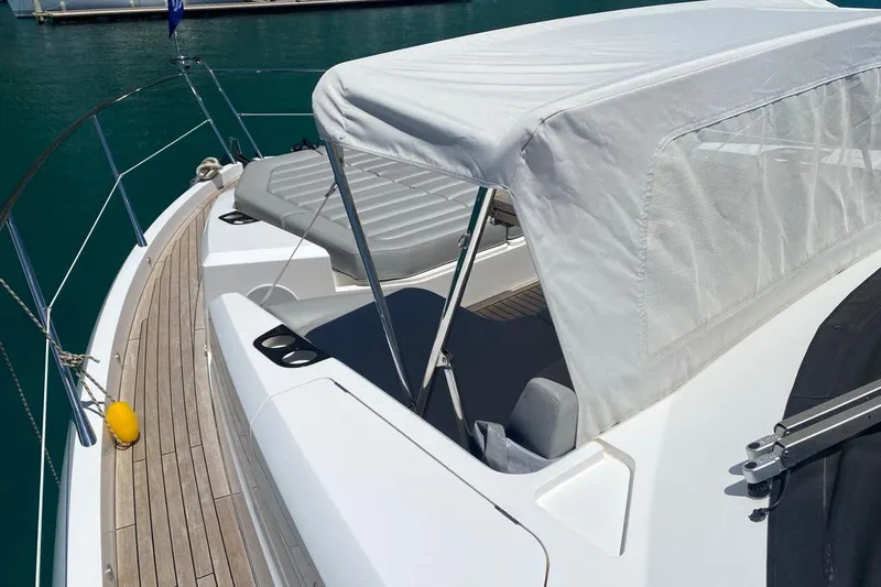  Yacht Photos Pics 2019 Sunseeker Manhattan 66 yacht deck with sunshade and seating area.