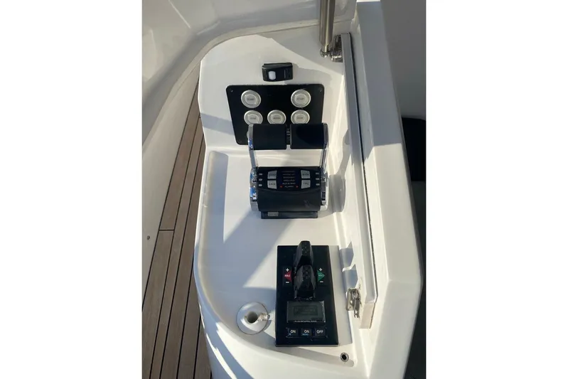  Yacht Photos Pics Control panel of 2019 Sunseeker Manhattan 66 yacht, featuring throttle and navigation controls.