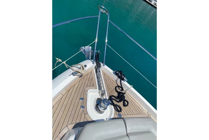  Yacht Photos Pics Bow of 2019 Sunseeker Manhattan 66 yacht with anchor and teak decking.